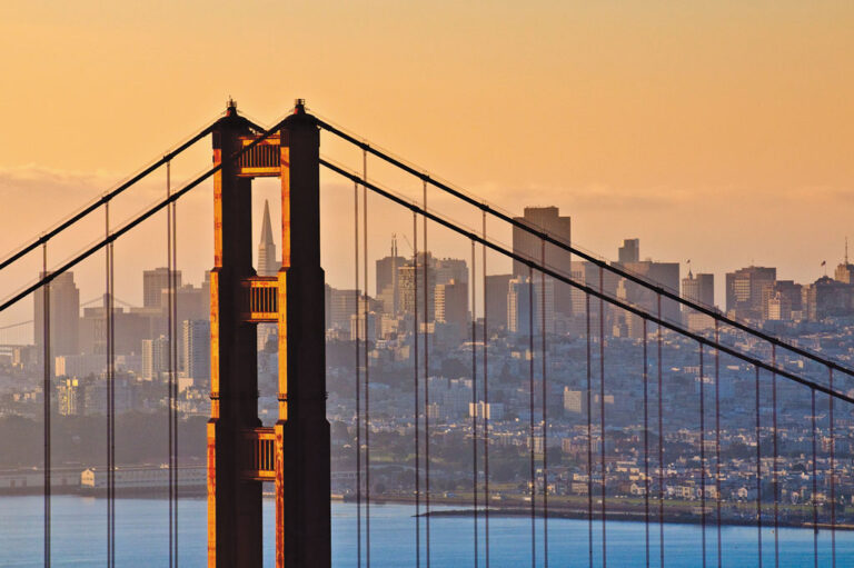 View of San Francisco Golden Gate Bridge with city skyline in the background