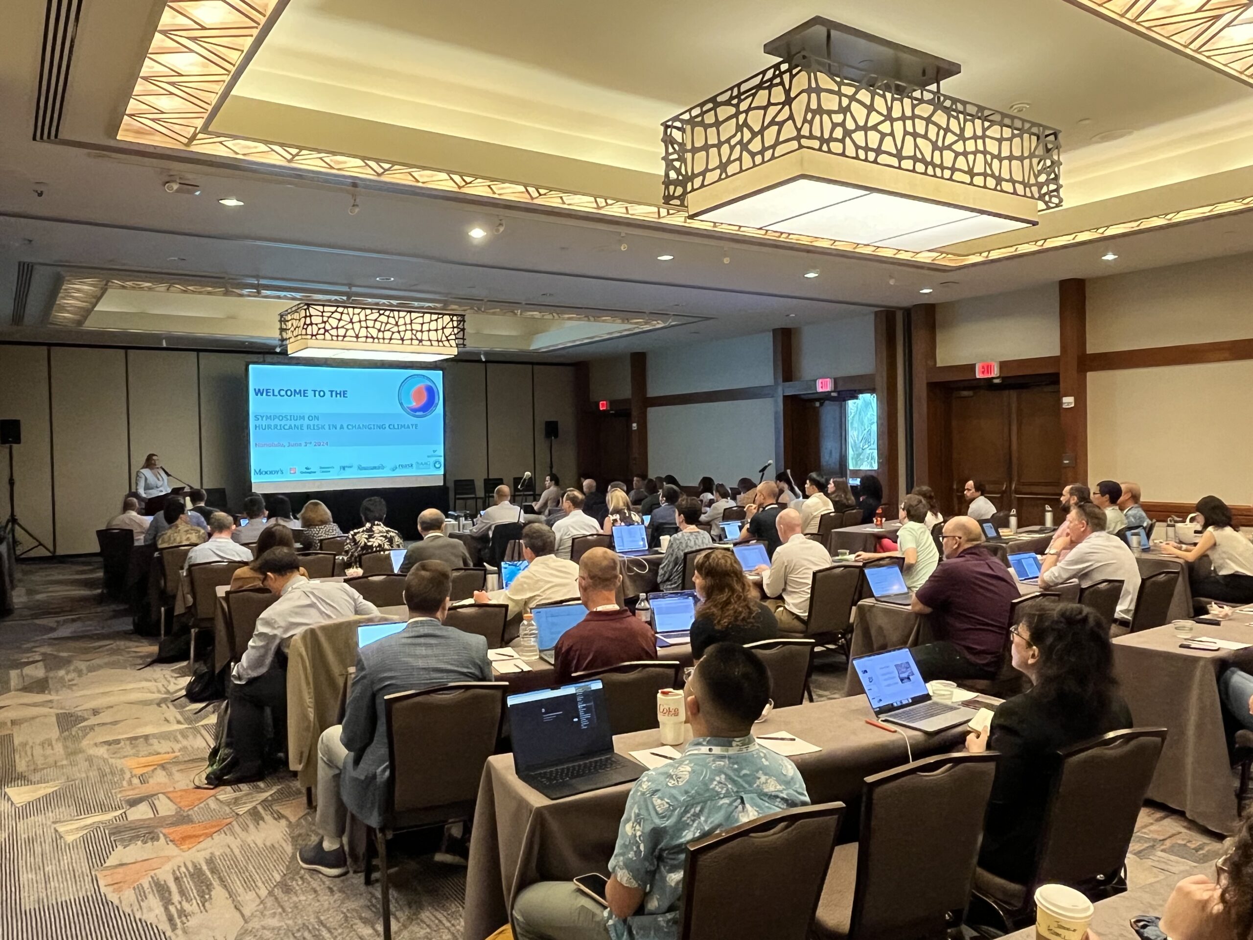 Attendees listen during a welcome session at the Symposium on Hurricane Risk. Credit: Jennifer Colins